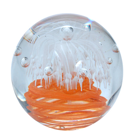 Sulfure en cristal grand model. Une base orange, surplombée par un motif  floral blanc